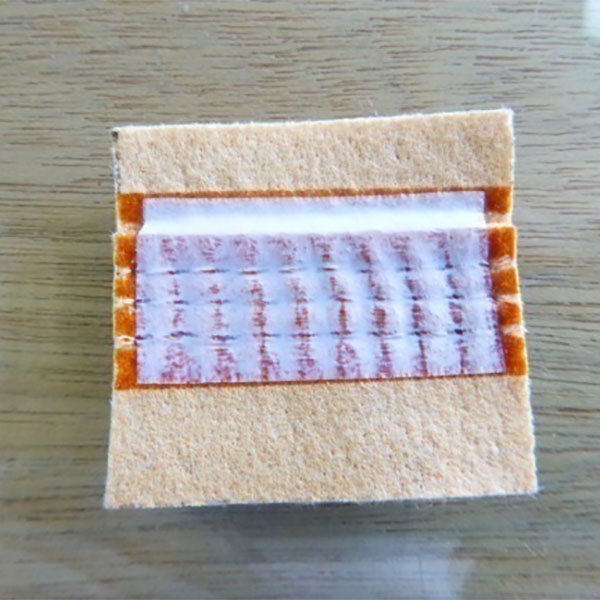 Opzioni per la prevenzione delle perdite della borsa per filtro nelle centrali elettriche a carbone: confronto tra il processo di rivestimento adesivo e il processo di applicazione del nastro PTFE